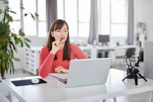 Women looking at reports on computer